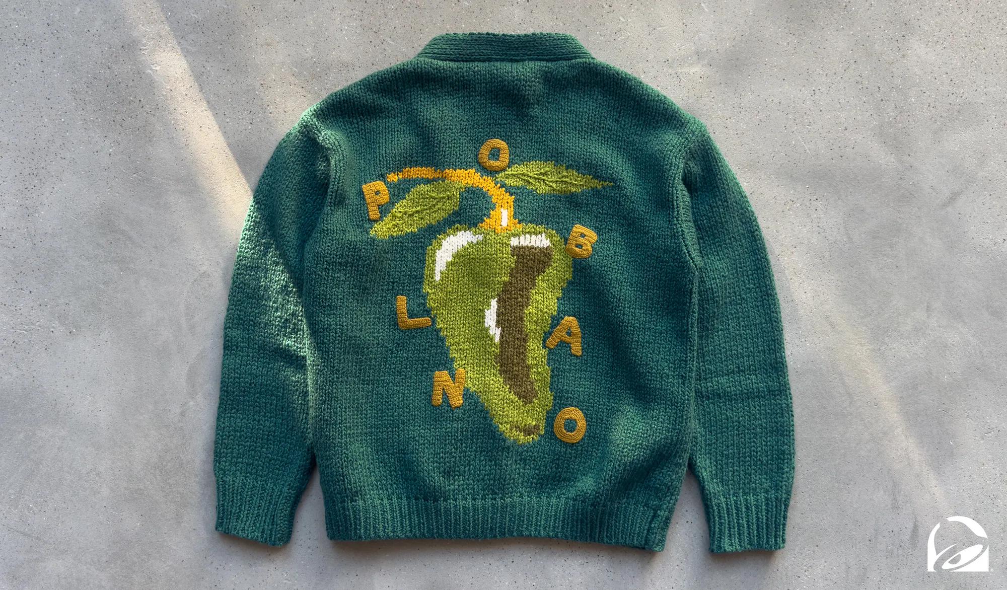 Taco Bell is dropping The Poblano Sweater, a cozy chunky-knit cardigan available exclusively to 300 Taco Bell Rewards Members in the Tuesday Drop on December 9.**